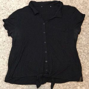 Black button up shirt. Short sleeved.